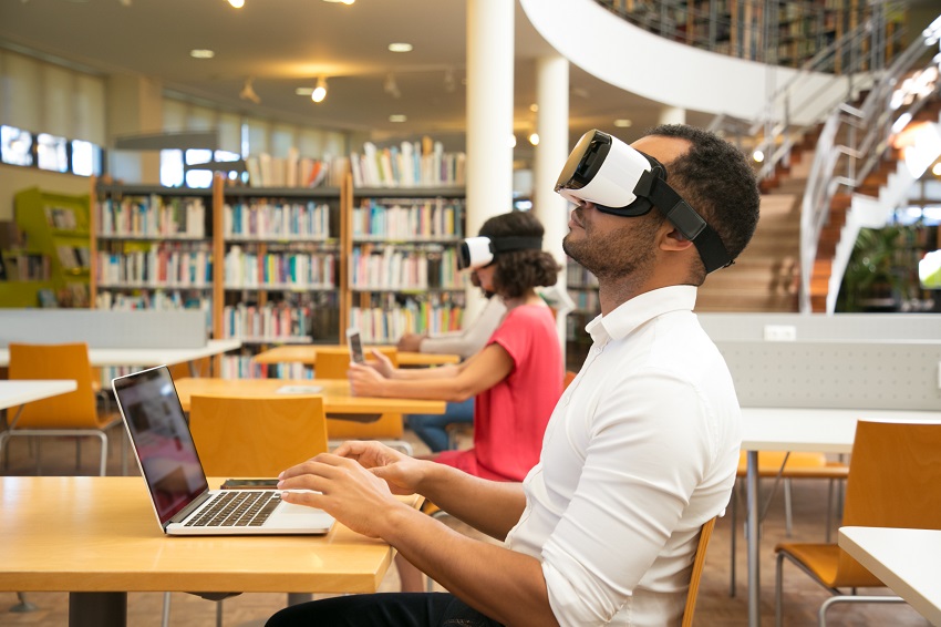 adult-male-student-with-vr-simulator-library.jpg